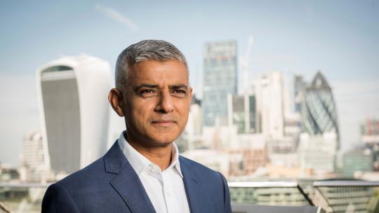 Mayor of London Sadiq Khan posing in front of City of London