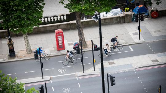 People cycling on London street