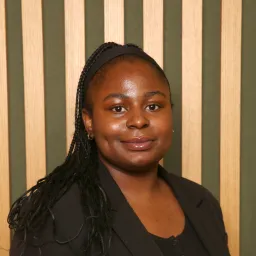 young woman smiling towards camera