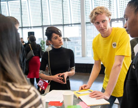 Young people discussing with each other at Stronger Futures event
