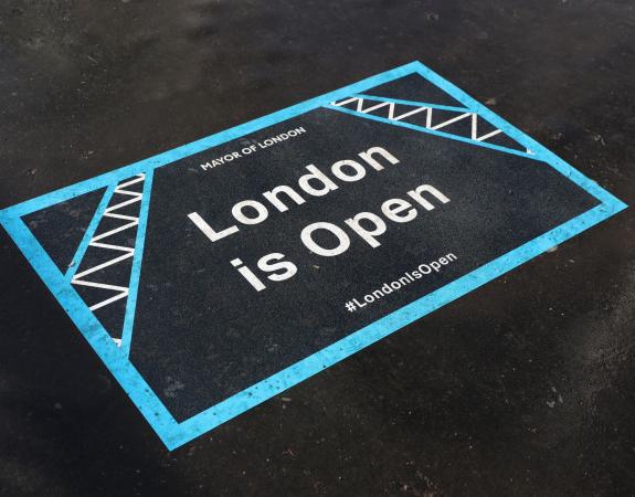 #LondonIsOpen sign on pavement