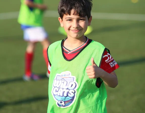 football youngster giving thumbs up