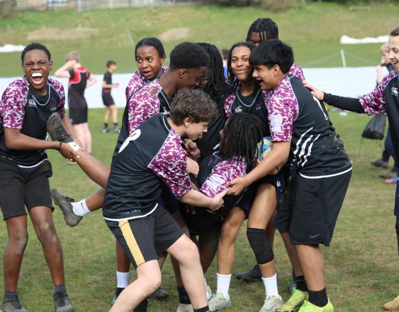 group of young people playing rugby