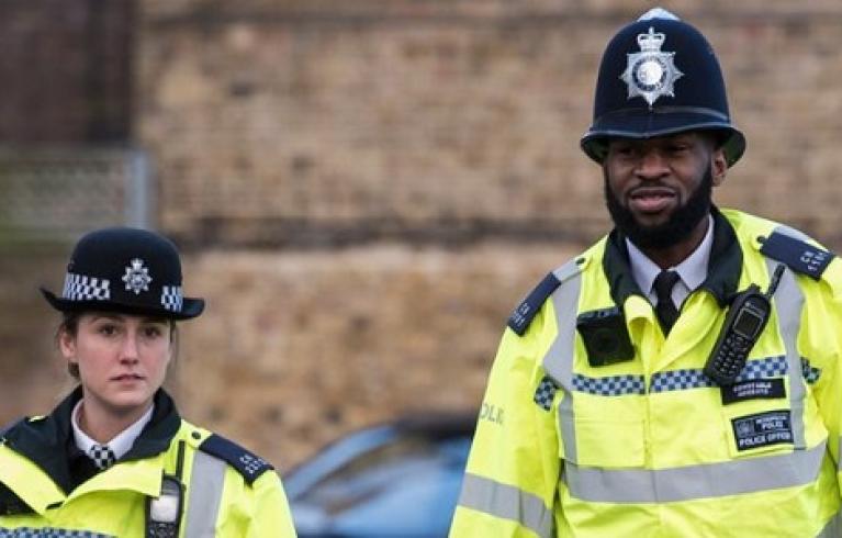 One male and one female police officer on foot patrol