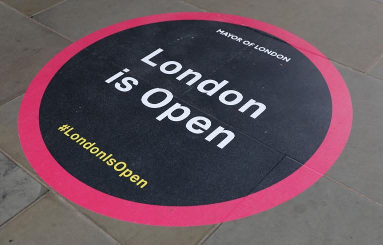 #LondonIsOpen sign on pavement