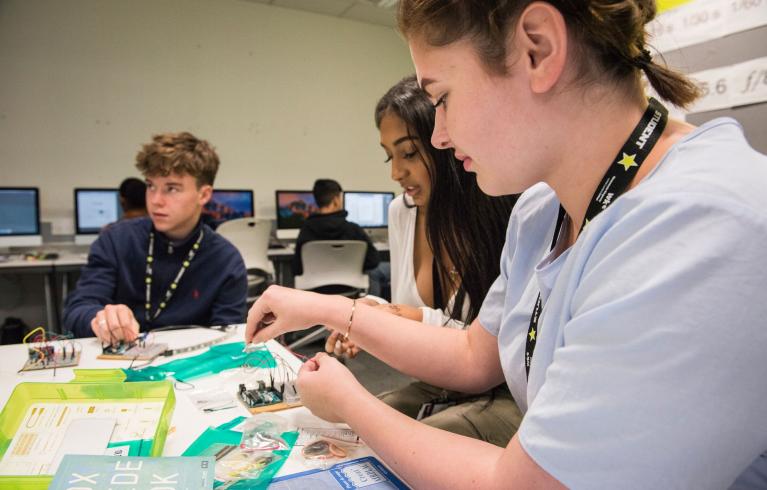 Young people working on a project at STEM Studies College