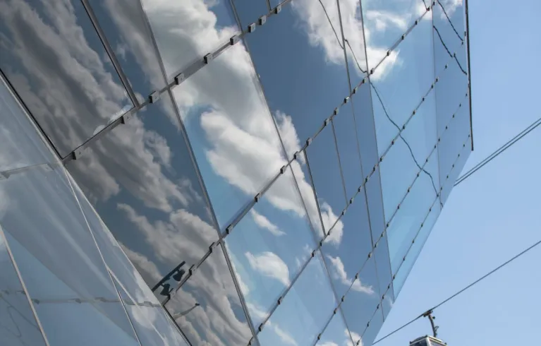 Reflection of the sky and clouds on the City Hall building.