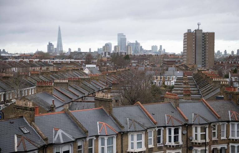 Photo of roofs in Peckham with London skyline in background