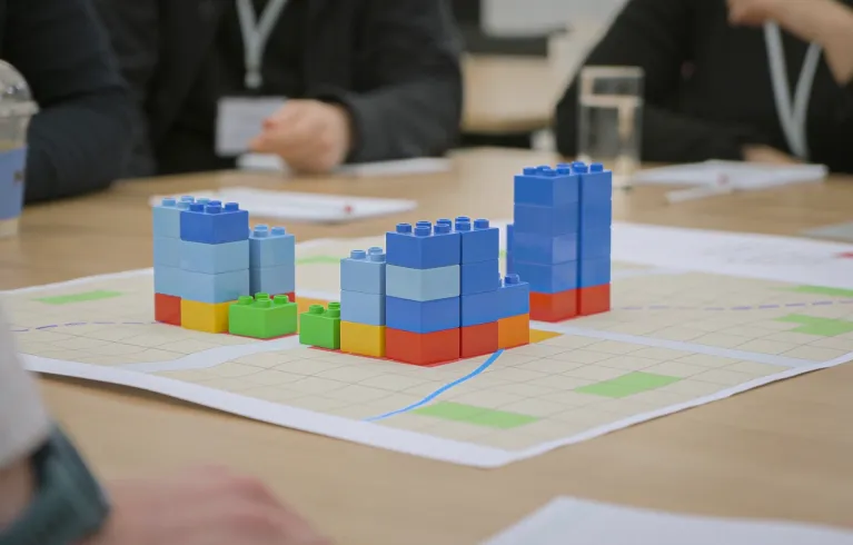 Buildings built with lego building blocks on a table