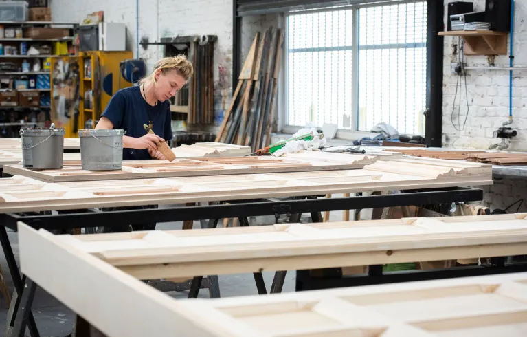 A woman working in a creative makerspace