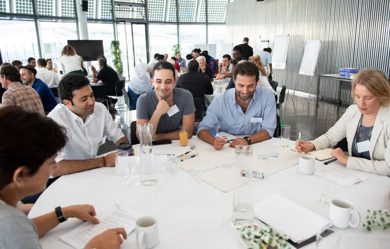 Photo showing a group of refugees participating in a workshop