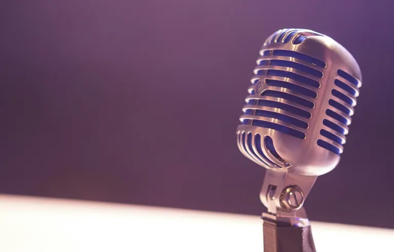 Microphone on purple background
