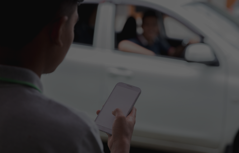 someone ordering a taxi on phone