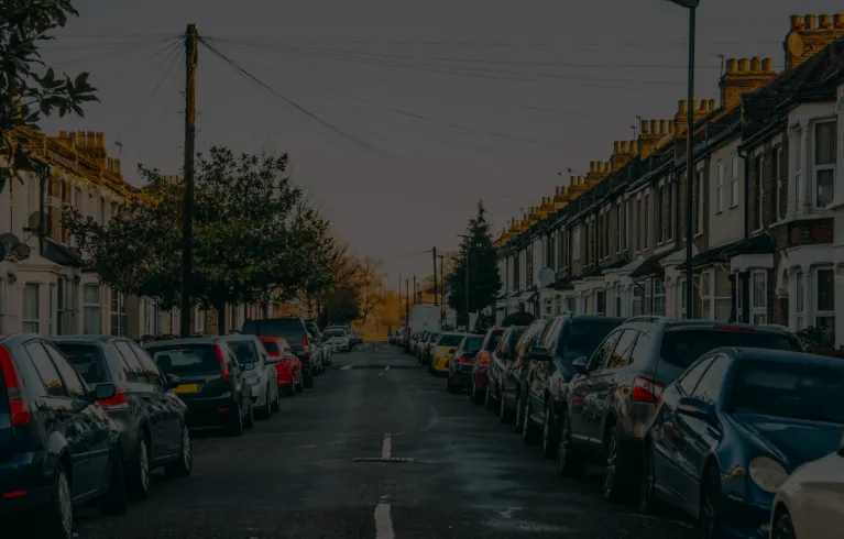 rows of cars outside houses