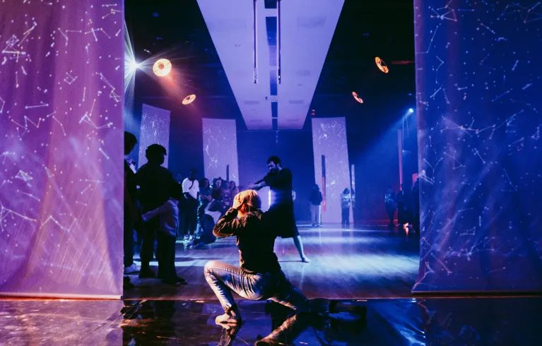 Dancer against purple background at Liberty Festival 2024