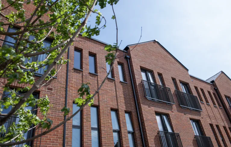 Brick house with tree in foreground