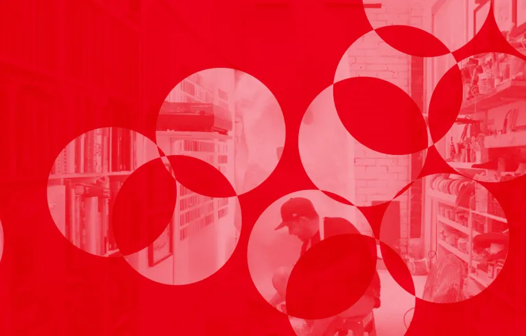 Man creating sculpture with red motif overlay