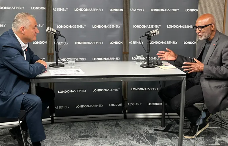 two men at table talking