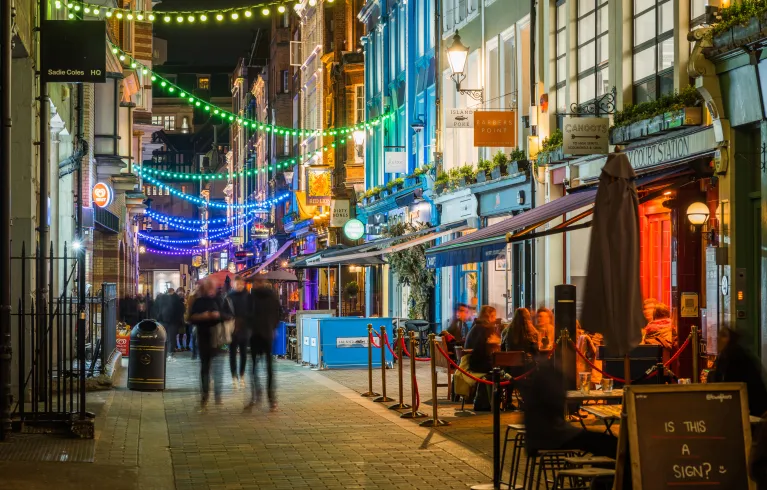 London street in the evening with bars and restaurants