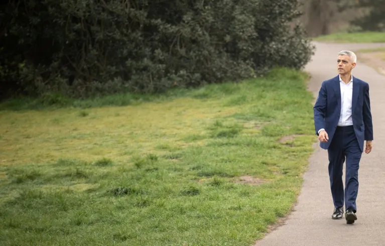 Sadiq Khan walking along a path