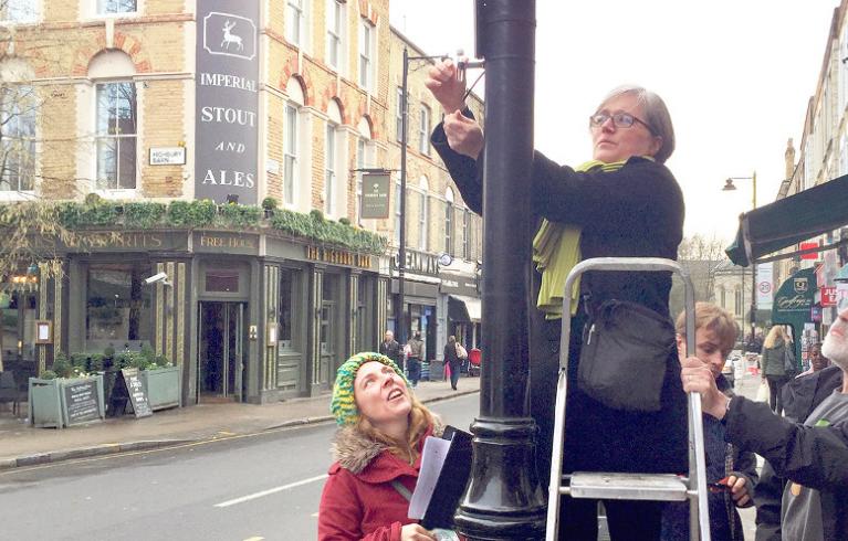 Caroline Russell putting up a diffusion tube