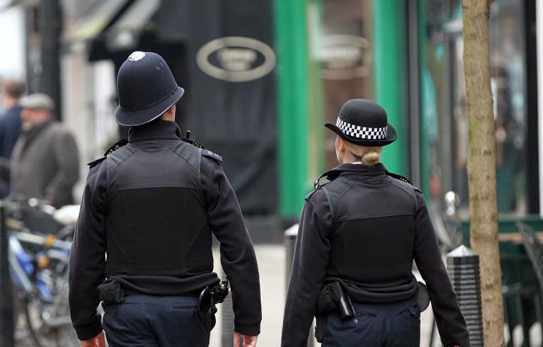 Two policemen patrolling the street