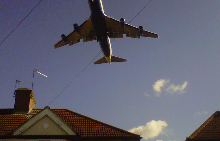 Plane over houses