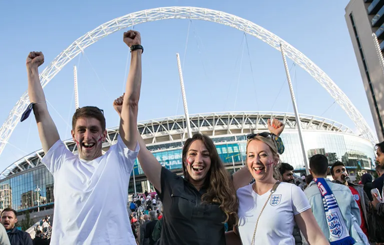 Fans celebrating outside Wembley Stadium