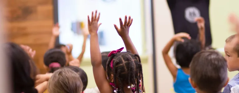 Children lifting hands