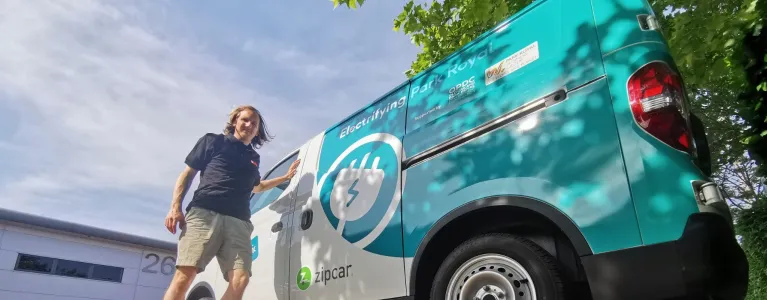 Man standing next to Zip van