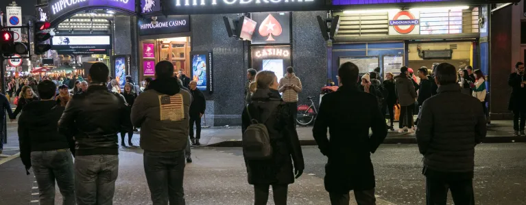Londoners in Leicester Square at night