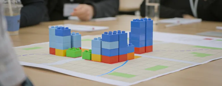 Buildings built with lego building blocks on a table