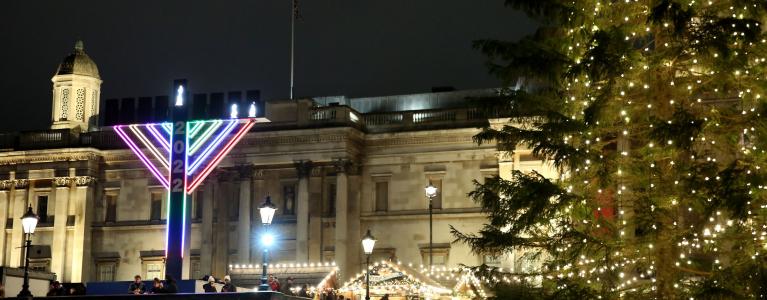 Giant Menorah in front of The National Gallery, next to a Christmas Tree