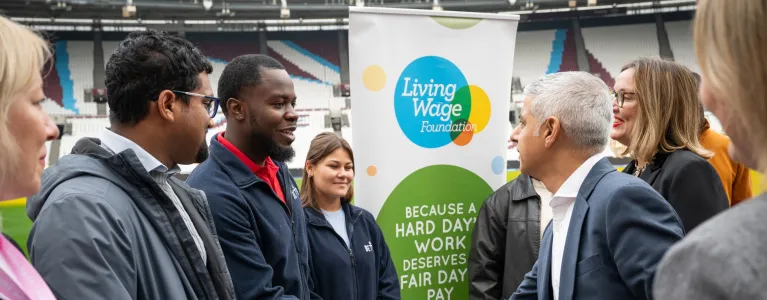 Mayor of London shaking hand with employees at London Living Wage rate announecment 2023, at London Stadium
