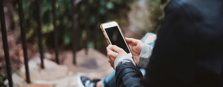 A woman texting on a mobile phone 