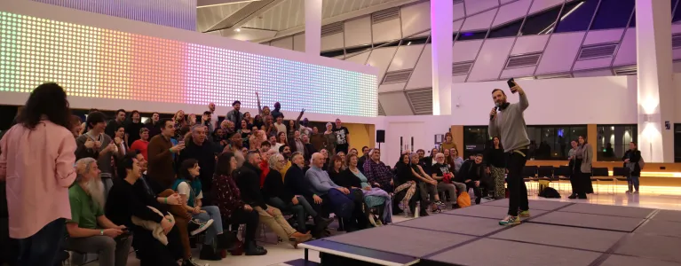 Zack Polanski taking a selfie with the audience in London's Living Room