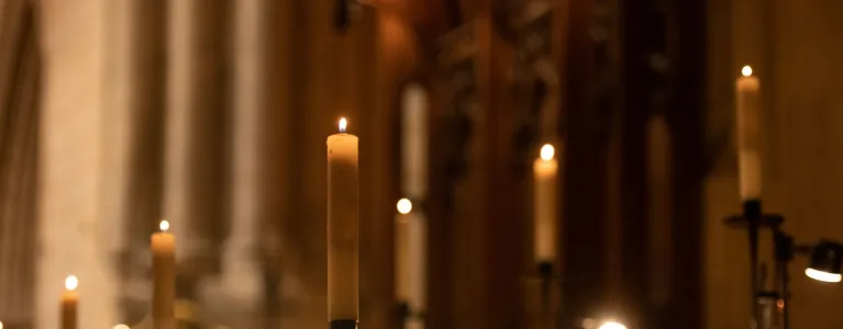 Candles lit at a church altar 