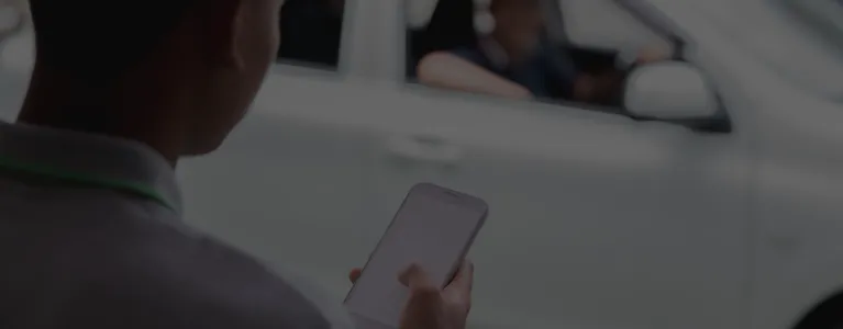 someone ordering a taxi on phone