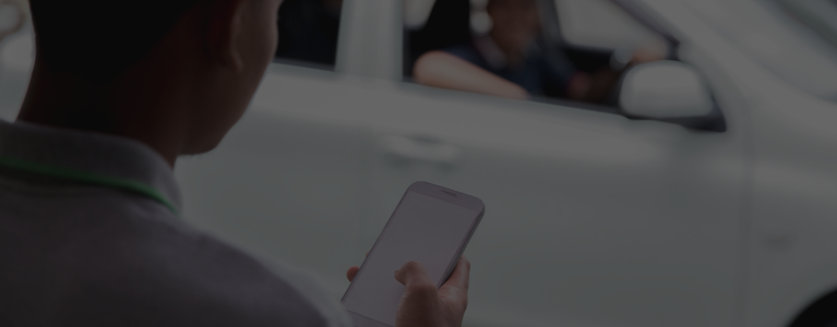 someone ordering a taxi on phone
