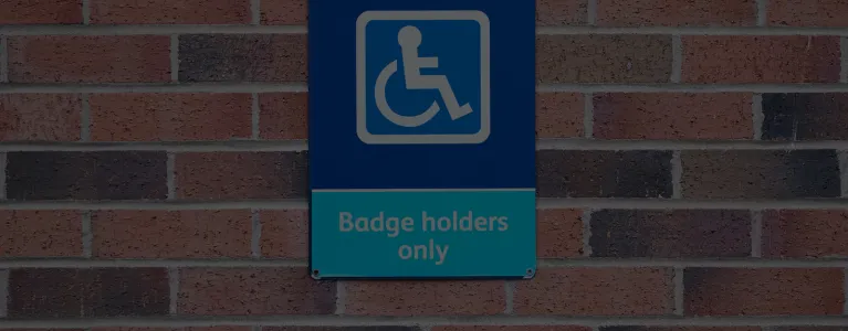 blue badge on wall