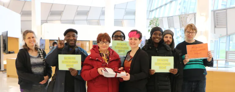 Zoë Garbett stands with residents of the Lesnes estate at City Hall