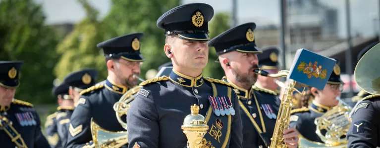 Army marching band with brass instruments and drums
