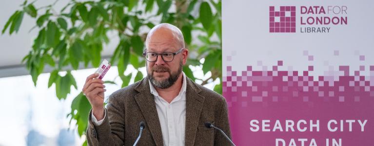 Theo Blackwell MBE speaking on a stage at the Data for London library launch event