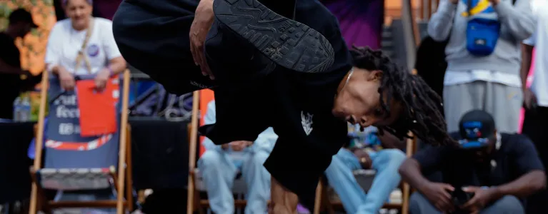 A streetdancer doing a handstand
