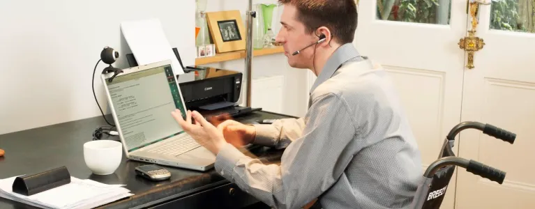 Man with disability using the computer