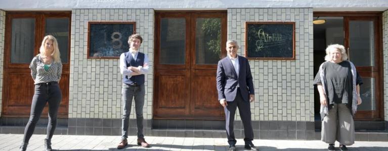Sadiq Khan stood outside a London business venue with its owners