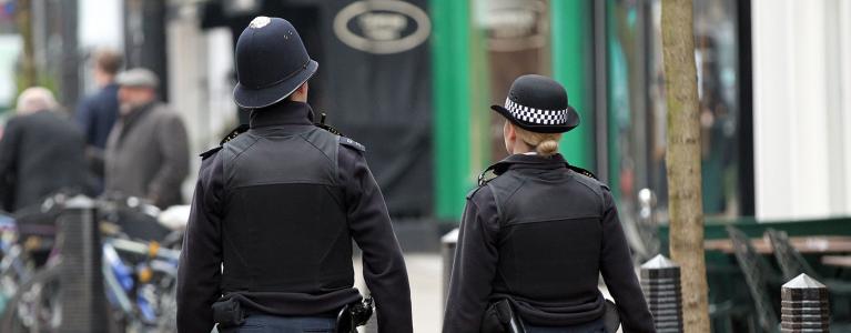 Two policemen patrolling the street