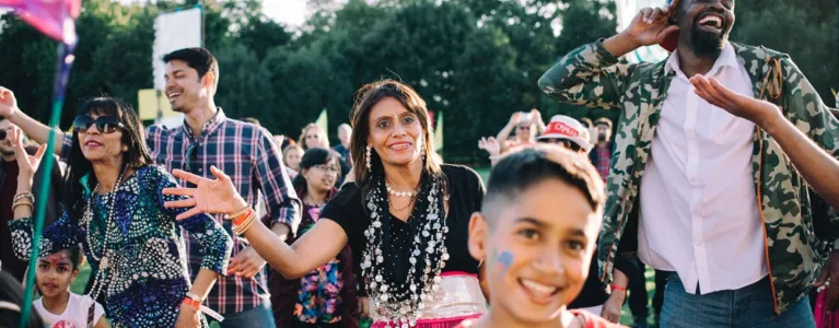 Adults and children dancing