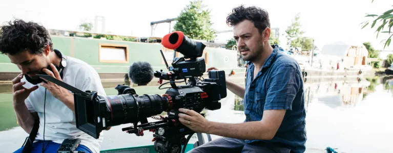 Man filming with a large camera