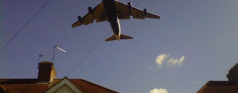 Plane over houses